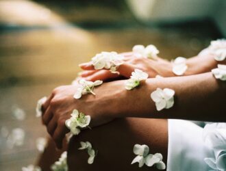 White flowers on woman hand