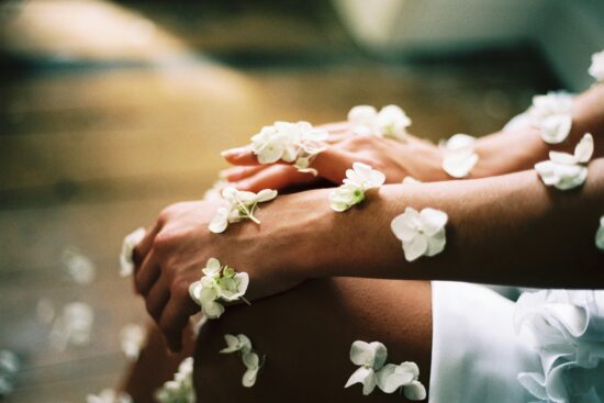 White flowers on woman hand