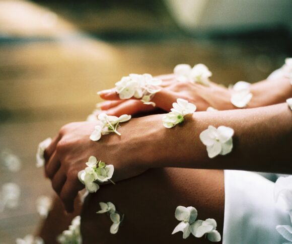 White flowers on woman hand